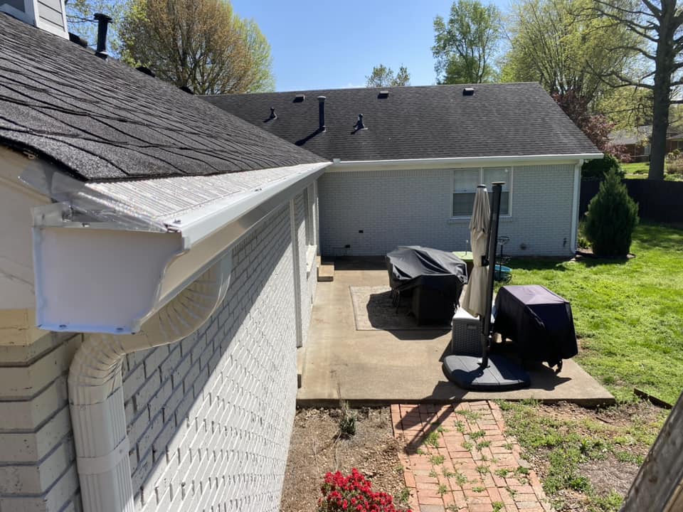 A back yard with a table and chairs