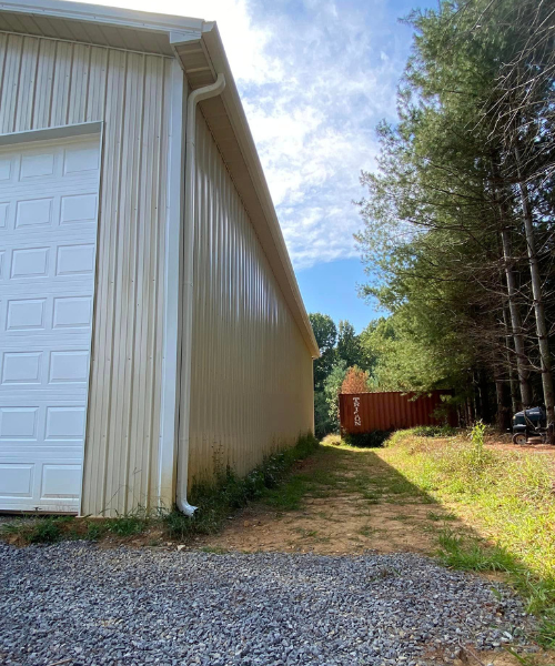 A garage and a truck parked in front of a building