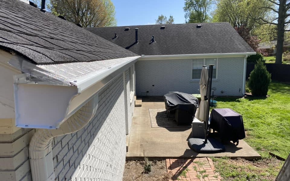 Gutter guard screening fitted over a clean white gutter on a Bowling Green, KY home