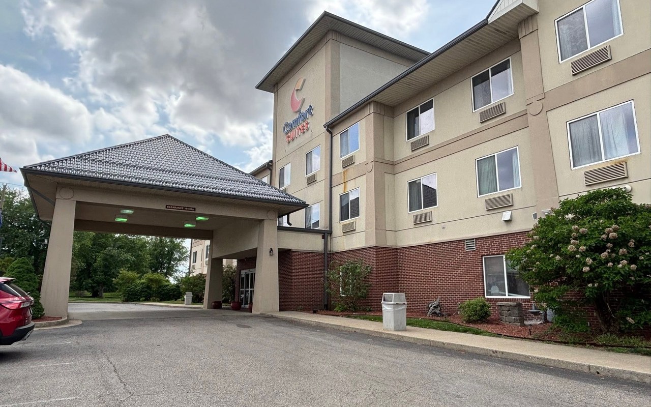 Downspouts running down the entry canopy columns of a hotel in Kentucky