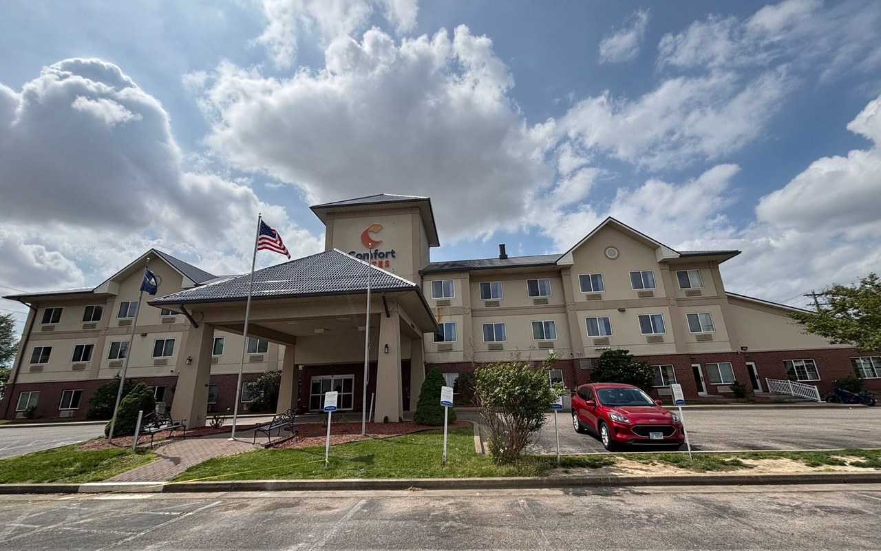 Commercial gutters and downspouts along the front elevation of a Kentucky hotel